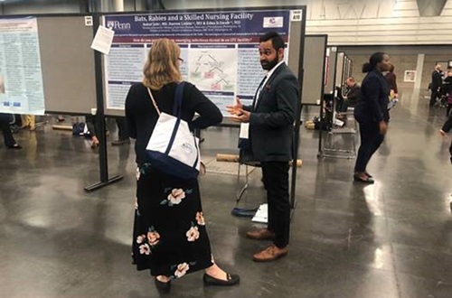 Mentor working with a fellow at a conference